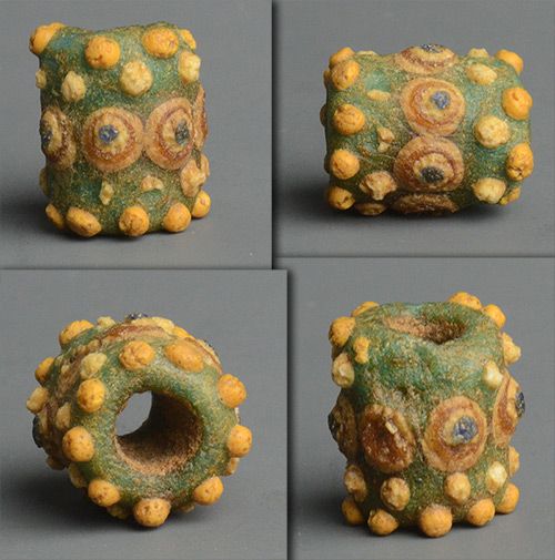 My_rarest_bead__Ancient_Phoenician__bumpy__eye_bead,_circa_600_BCE_-_400_BCE__The_bead_has_a_significant_chip_on_one_side,_and_has_some_missing_decorations,_but_just_gorgeous!.jpg (43.7 KB)